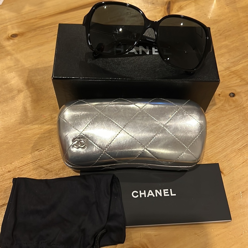 Chanel sunglasses with case, bag, box, paperwork, and cloth.